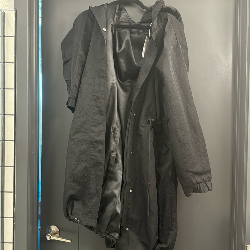 Black Trench coat with adjustable drawstrings and detachable hood.